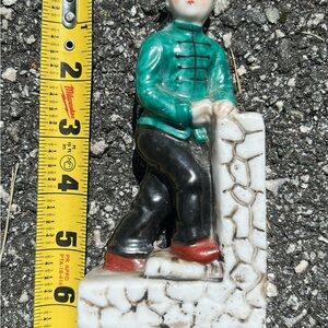 Ceramic Figurine with Green Jacket and Red Shoes